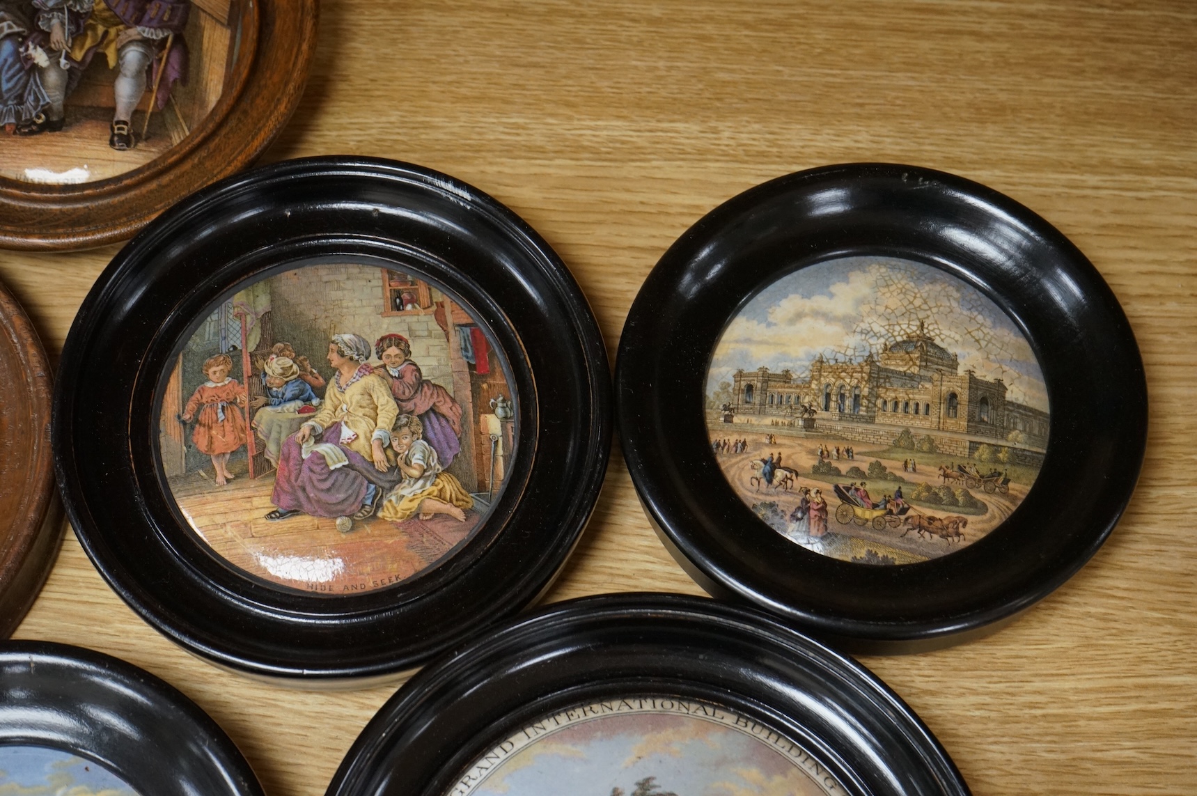 A collection of eleven framed pot lids, including one of the Chrystal Palace; The Grand International Building of 1851, For The Exhibition of Art and Industry of all Nations, Crystal Palace pot lid 12.5cm diameter not in